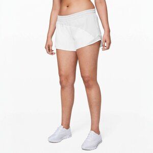 LULULEMON HOTTY HOT SHORT *ASYM IN LIGHT CHROME/WHITE SIZE 4